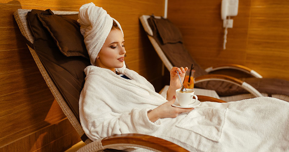 sexy-girl-relaxing-with-cup-of-coffee-in-spa-chair-the-story-of-coffee